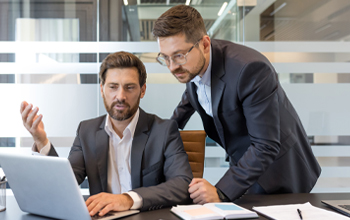 Two business directors consulting in office
