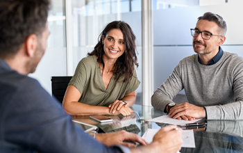 Man and woman in business consultation with advisor